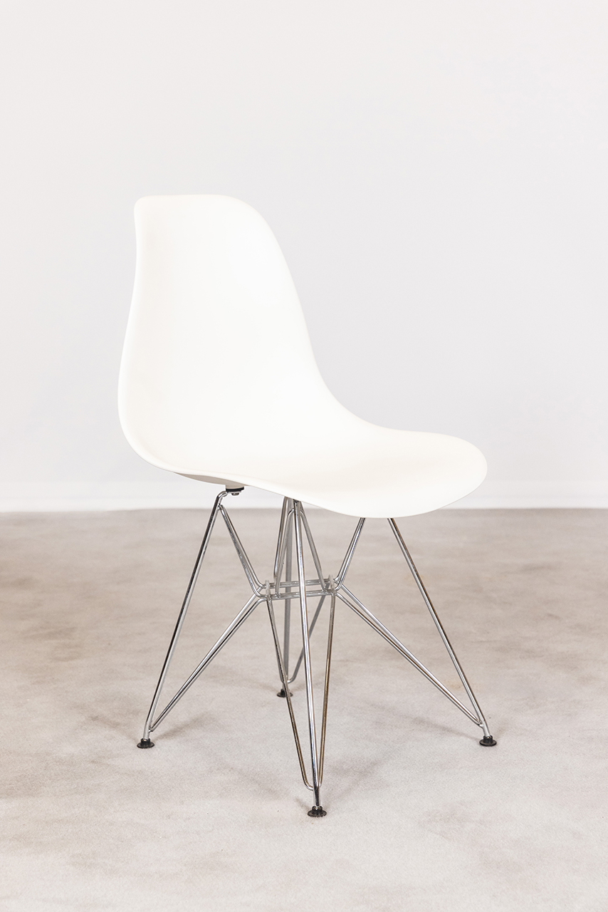 White chair with metal legs